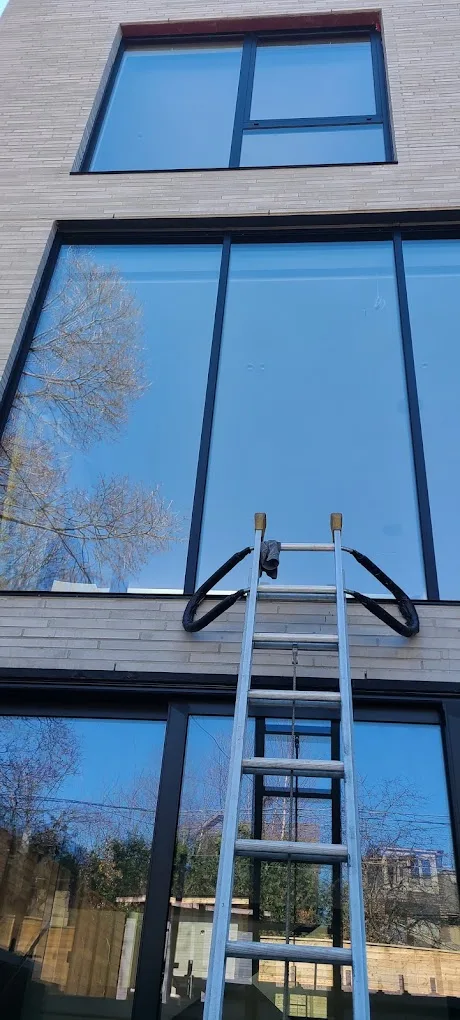 Professional ladder setup for large windows